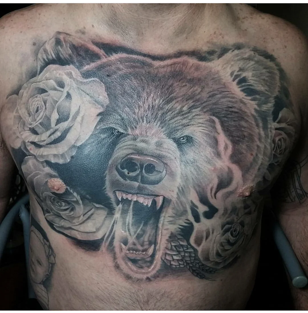 Realistic bear and rose tattoo