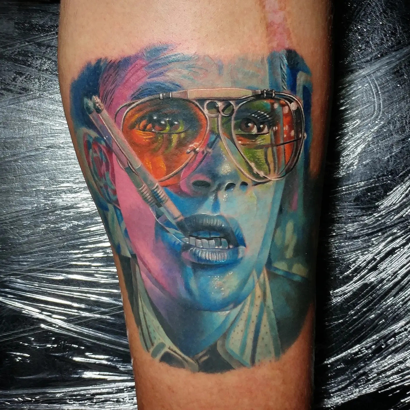 Vivid color portrait tattoo with glasses