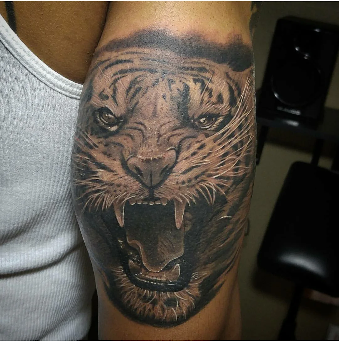 Black-and-grey roaring tiger tattoo